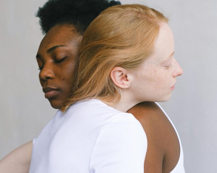 Tender embrace between an interracial couple showcasing love and connection.